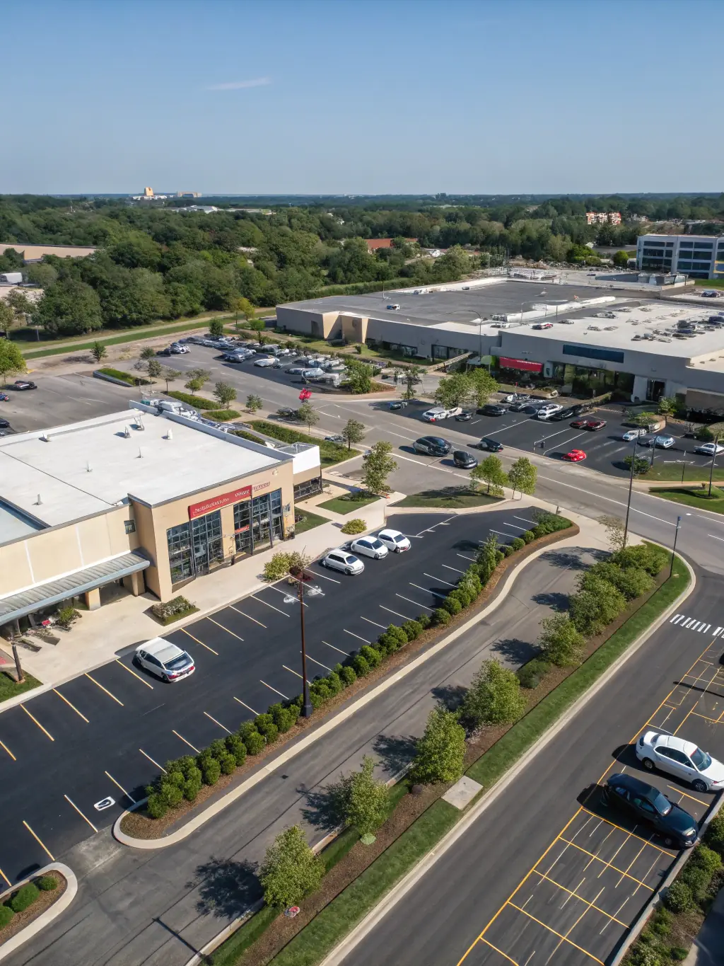 A well-maintained commercial property with lush landscaping, reflecting Astro AMC's expertise in property management. The image should convey professionalism and attention to detail.